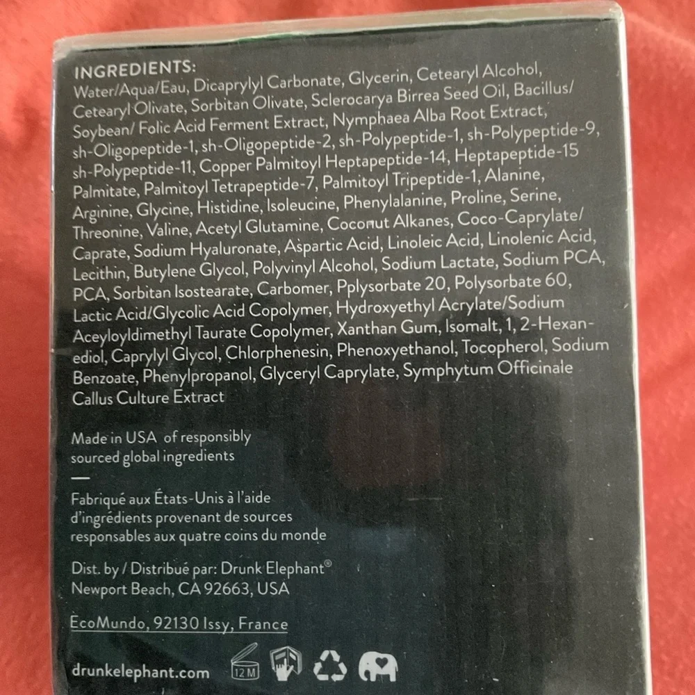Drunk Elephant Facial Moisturizer with Green Text